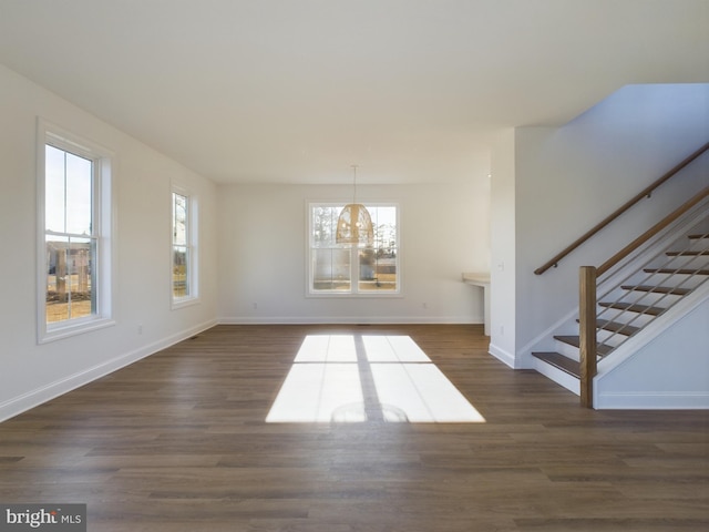 interior space featuring dark hardwood / wood-style floors and a healthy amount of sunlight