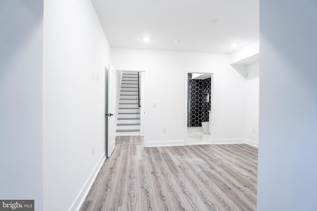 spare room featuring light hardwood / wood-style floors