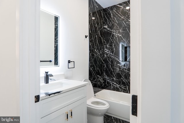 full bathroom featuring vanity, toilet, and tiled shower / bath