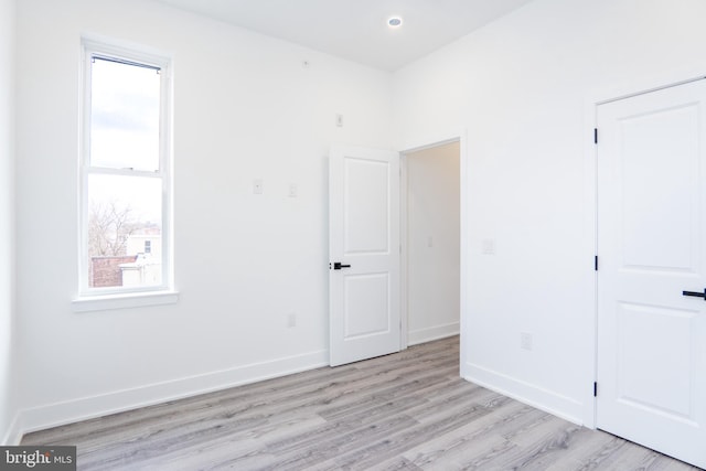 unfurnished room featuring light wood-type flooring