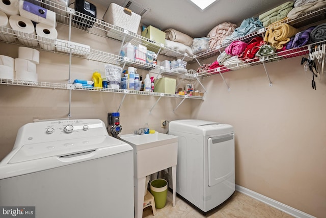 laundry area featuring washing machine and clothes dryer