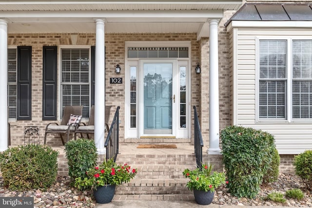 doorway to property featuring covered porch