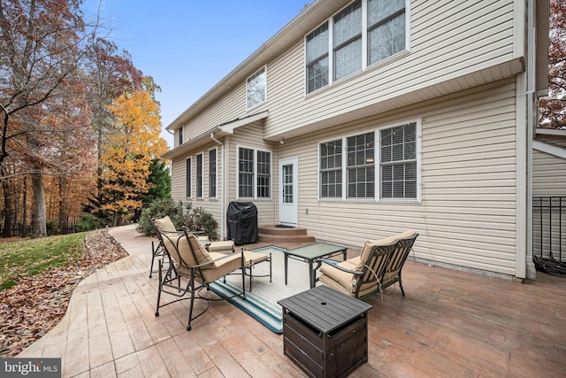 view of patio featuring a wooden deck and grilling area