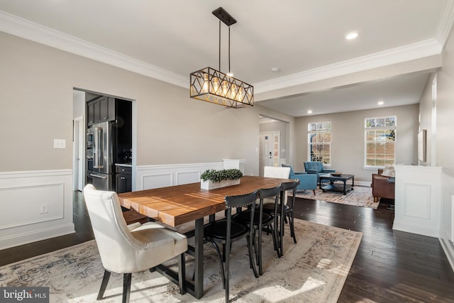 dining room featuring dark hardwood / wood-style flooring and ornamental molding