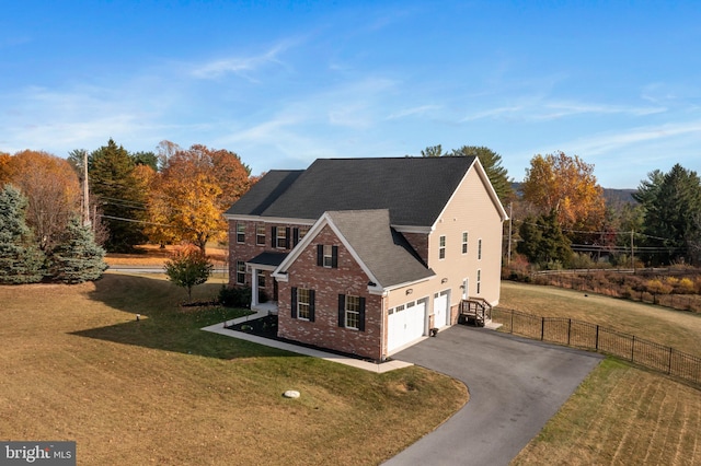 view of front of property with a garage and a front yard