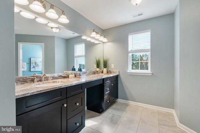 bathroom with tile patterned flooring and vanity