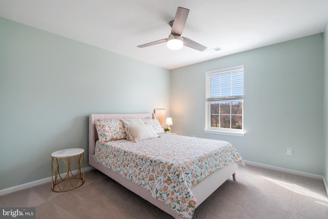 bedroom featuring light colored carpet and ceiling fan