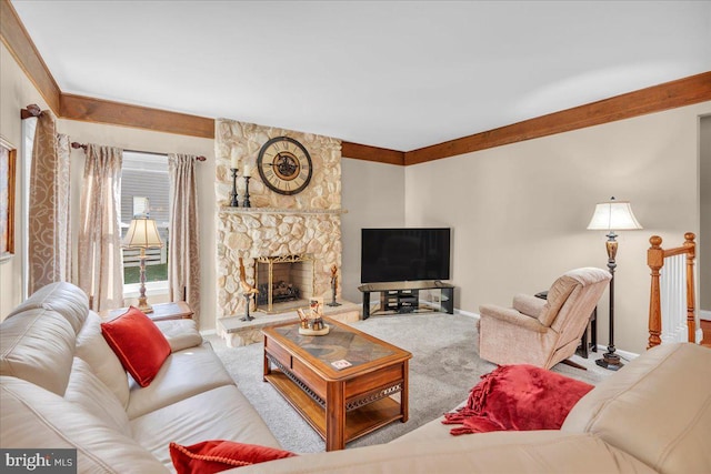 carpeted living room with a stone fireplace