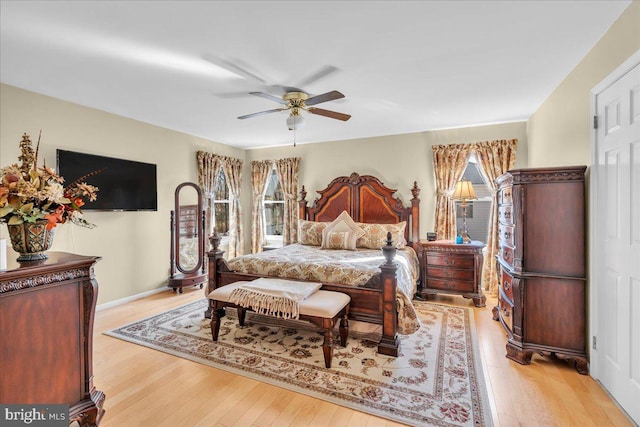 bedroom with light hardwood / wood-style floors and ceiling fan