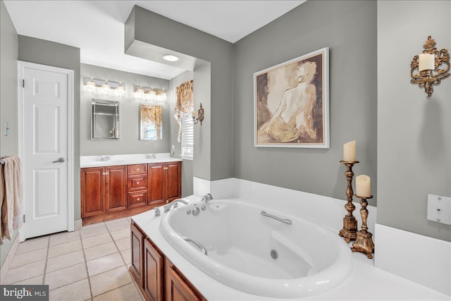 bathroom featuring vanity, a tub, and tile patterned flooring