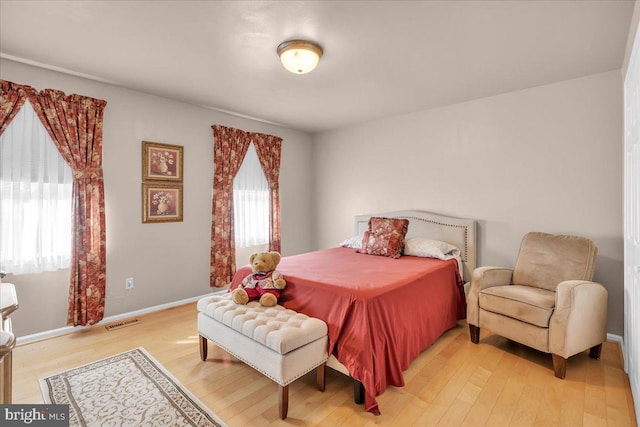 bedroom with hardwood / wood-style floors