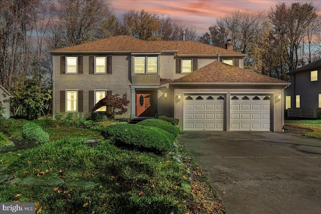 view of front of property featuring a garage