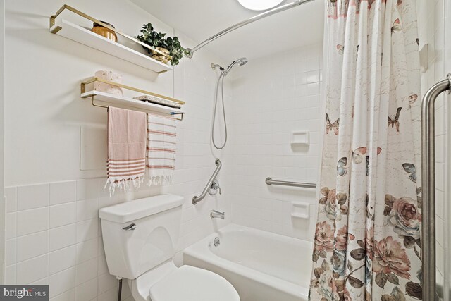 bathroom with shower / tub combo, tile walls, and toilet