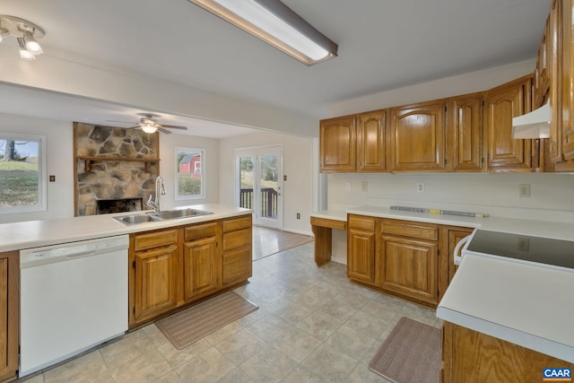 kitchen featuring ceiling fan, a wealth of natural light, sink, and white dishwasher