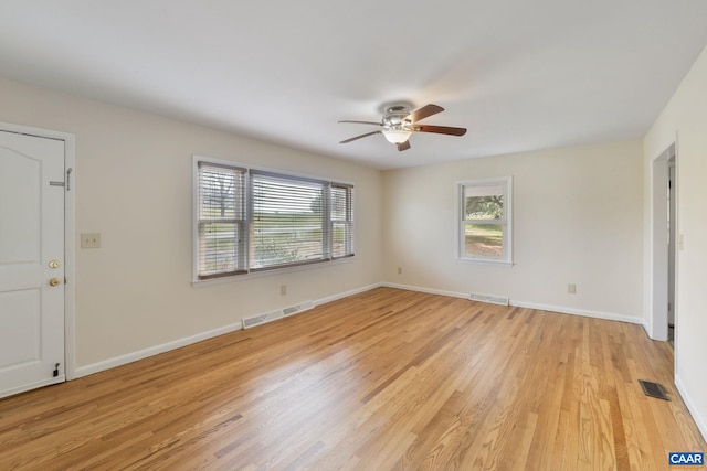 unfurnished room featuring light hardwood / wood-style flooring and ceiling fan