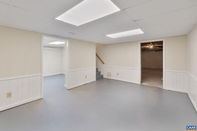 basement featuring a paneled ceiling