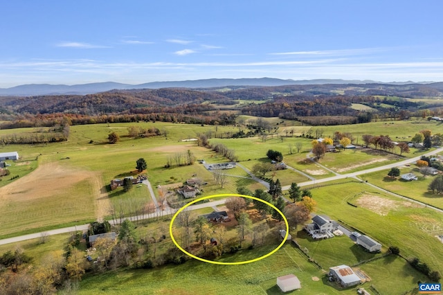 aerial view with a mountain view and a rural view