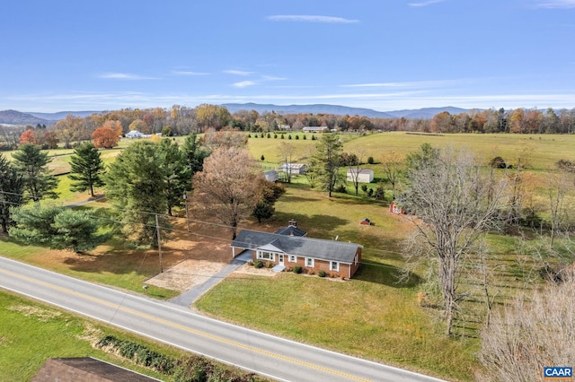 birds eye view of property featuring a mountain view and a rural view