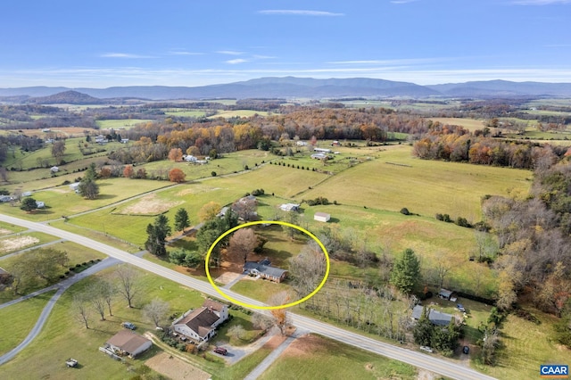 drone / aerial view featuring a rural view and a mountain view