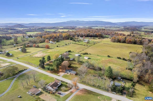 drone / aerial view featuring a rural view and a mountain view