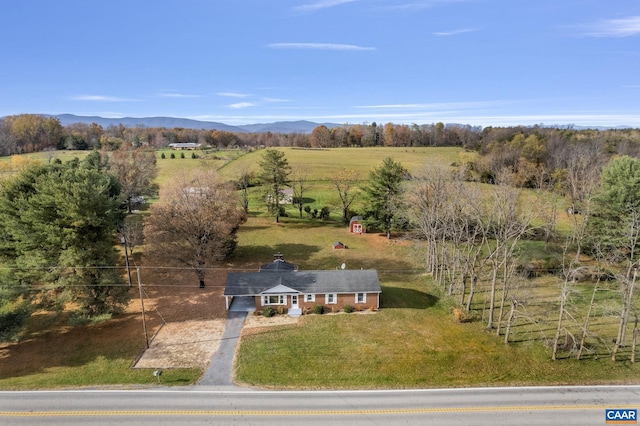 drone / aerial view featuring a mountain view and a rural view