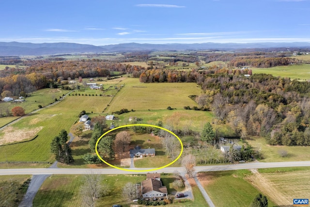 birds eye view of property featuring a mountain view and a rural view