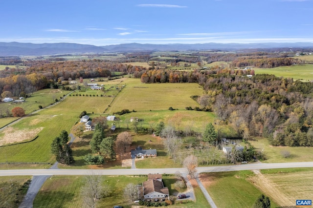 birds eye view of property featuring a mountain view and a rural view