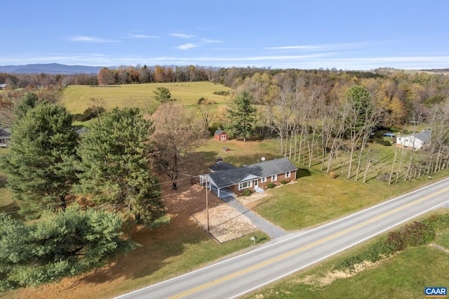 drone / aerial view featuring a rural view and a mountain view