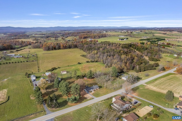 drone / aerial view featuring a mountain view and a rural view