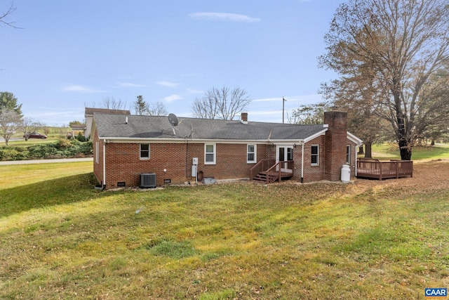 rear view of property featuring a yard, a deck, and cooling unit