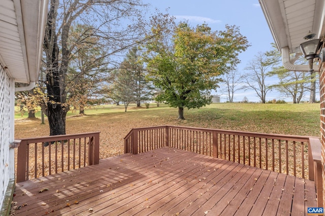 wooden deck featuring a yard