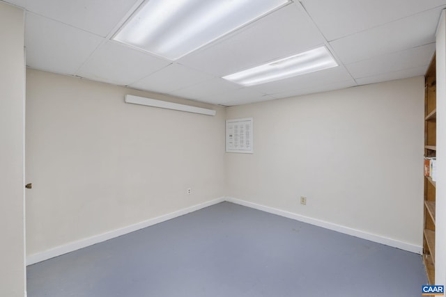 basement featuring a drop ceiling