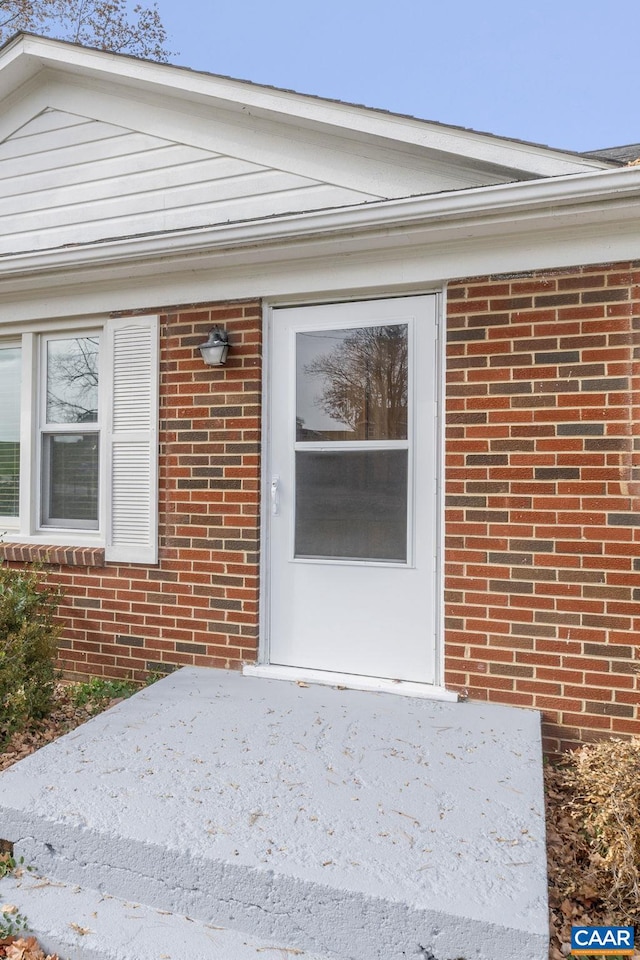 doorway to property featuring a patio