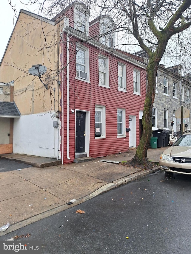 view of front of home featuring cooling unit