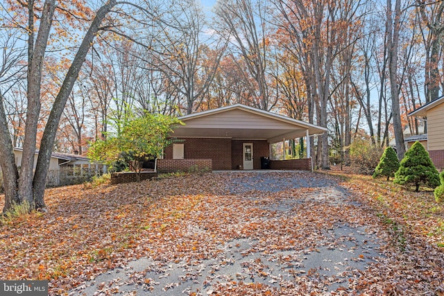 view of home's exterior featuring a carport