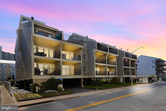 view of outdoor building at dusk