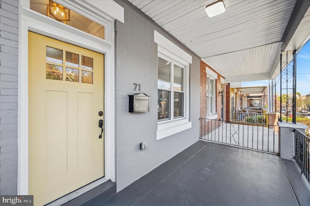 entrance to property featuring a porch