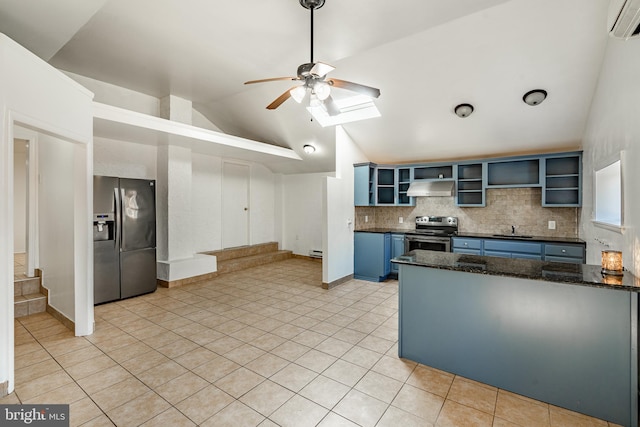 kitchen featuring stainless steel appliances, exhaust hood, sink, lofted ceiling with skylight, and blue cabinets