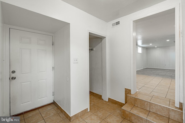 corridor with light tile patterned floors