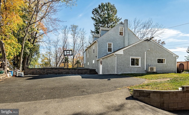 view of side of home with a lawn