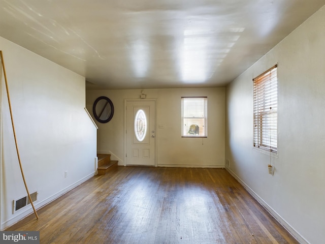 entryway with dark hardwood / wood-style floors