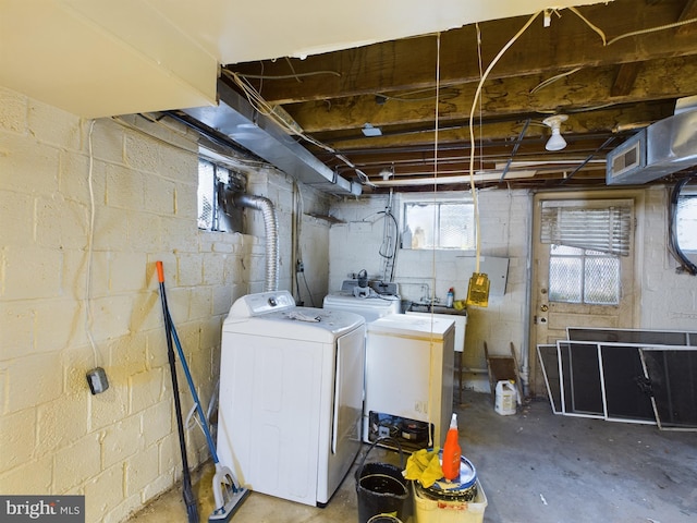 laundry area with independent washer and dryer