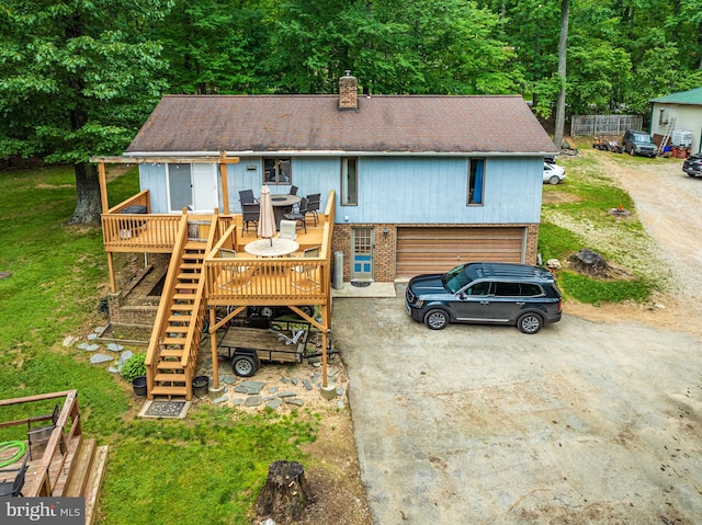 view of front of property featuring a front lawn and a wooden deck