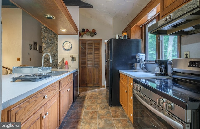 kitchen with black appliances, ventilation hood, backsplash, sink, and vaulted ceiling