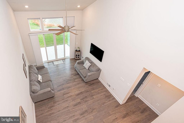 living room featuring hardwood / wood-style flooring and ceiling fan