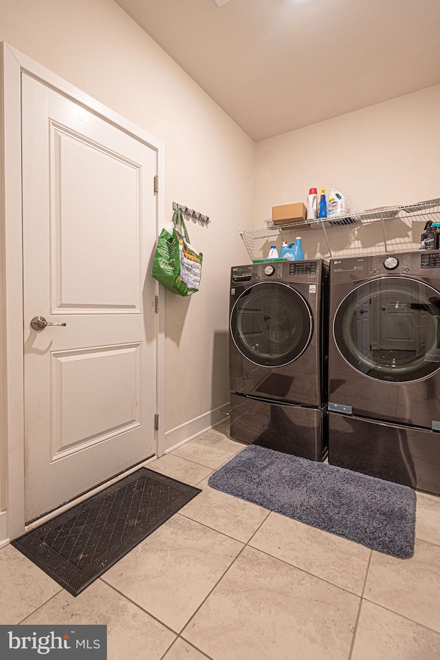 laundry area featuring tile patterned floors and independent washer and dryer