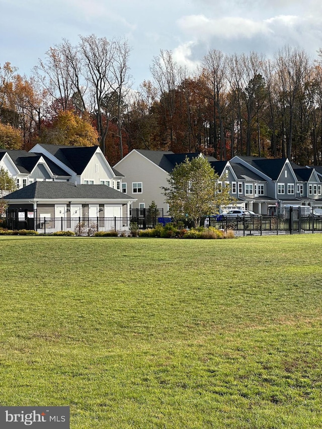 rear view of property with a lawn