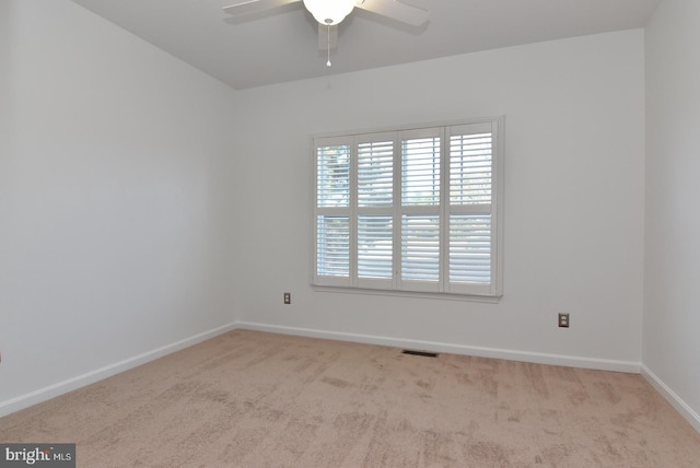 carpeted empty room with ceiling fan