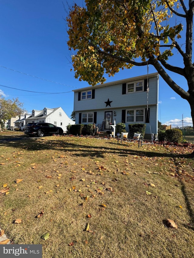 front facade with a front lawn