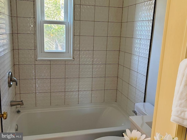 full bathroom with vanity, toilet, and tiled shower / bath combo